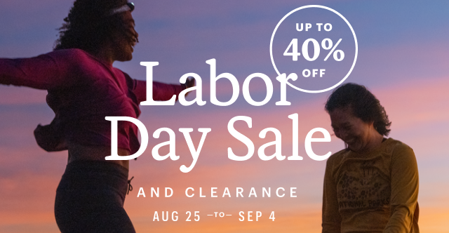 Two hikers celebrate in the sunset. Headline: Labor Day Sale AND CLEARANCE